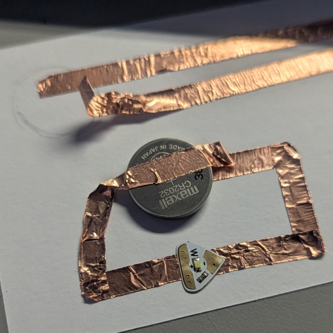 Did I burn the LED, or is the battery faulty? I wanted to make at least one working circuit, so I made a very basic one. When I pressed hard on the LEDs, they flashed again. At least that means it's not a battery or LED fault. However, for some reason, the LED light is very picky and won’t just flash on properly. 